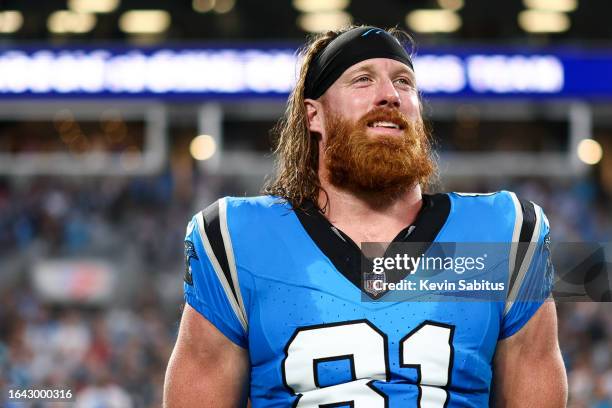 Hayden Hurst of the Carolina Panthers smiles on the sidelines prior to an NFL preseason football game against the Detroit Lions at Bank of America...