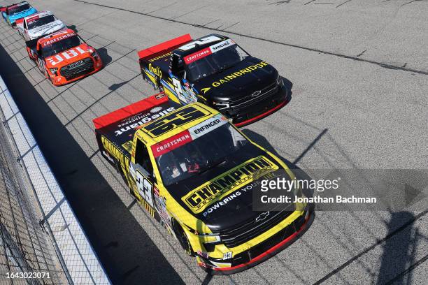 Grant Enfinger, driver of the Champion Power Equipment Chevrolet, Nick Sanchez, driver of the Gainbridge Chevrolet, and Taylor Gray, driver of the...