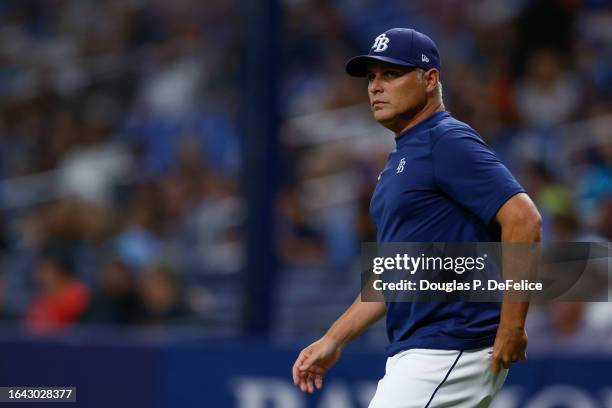 Manager Kevin Cash of the Tampa Bay Rays walks to the mound during the sixth inning against the Colorado Rockies at Tropicana Field on August 23,...