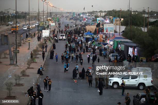 Shiite Muslim pilgrims march from Baghdad towards the shrine city of Karbala on September 3, 2023 ahead of the Arbaeen religious festival,...