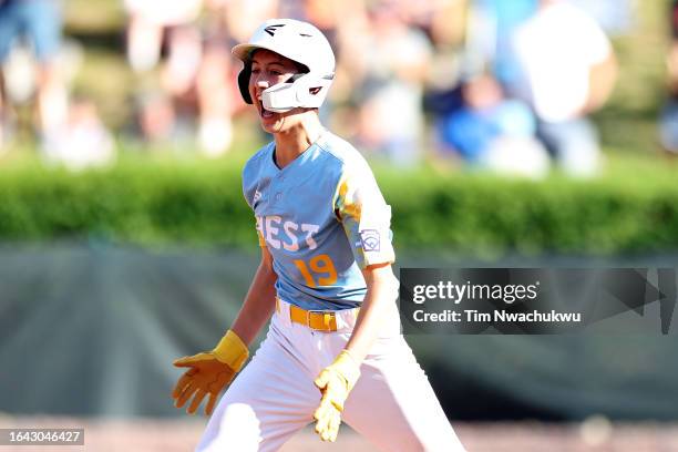 Louis Lappe of the West Region team from El Segundo, California rounds bases after hitting a walk-off home run to defeat the Caribbean Region team...