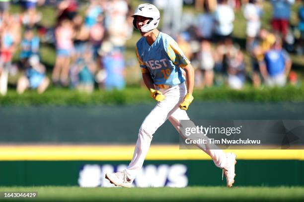 Louis Lappe of the West Region team from El Segundo, California rounds bases after hitting a walk-off home run to defeat the Caribbean Region team...
