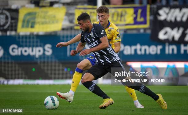Charleroi's Oday Dabbagh and STVV's Mathias Delorge fight for the ball during a soccer match between Sporting Charleroi and Sint-Truiden VV, Sunday...