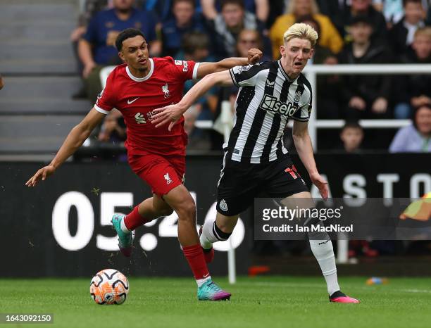 Anthony Gordon of Newcastle United vies with Trent Alexander-Arnold of Liverpool during the Premier League match between Newcastle United and...