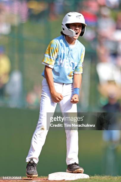 Max Baker of the West Region team from El Segundo, California reacts after hitting a triple during the fourth inning against the Caribbean Region...