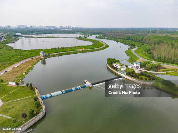 Aerial photo taken on September 2, 2023 shows a rubber dam on the left and a wetland inlet gate on the right of the central island of the river in...