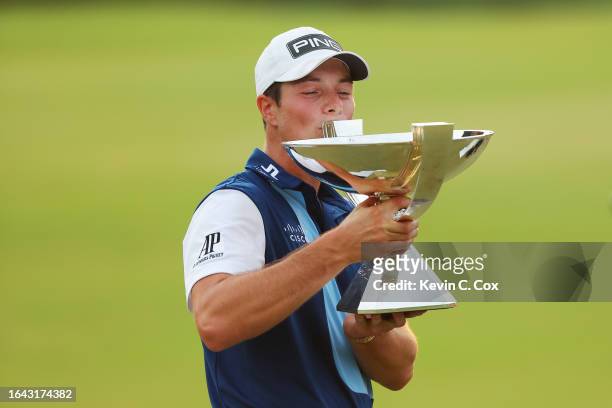 Viktor Hovland of Norway celebrates with the FedEx Cup after winning during the final round of the TOUR Championship at East Lake Golf Club on August...