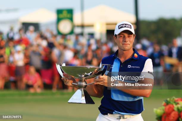 Viktor Hovland of Norway celebrates with the FedEx Cup after winning during the final round of the TOUR Championship at East Lake Golf Club on August...