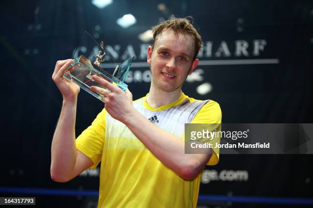 James Willstrop of England holds his trophy after winning the Canary Wharf Squash Classic 2013 defeating Peter Barker of England in the final on...
