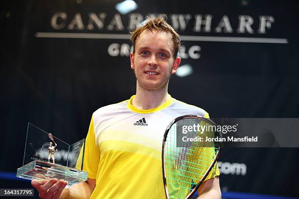 James Willstrop of England holds his trophy after winning the Canary Wharf Squash Classic 2013 defeating Peter Barker of England in the final on...