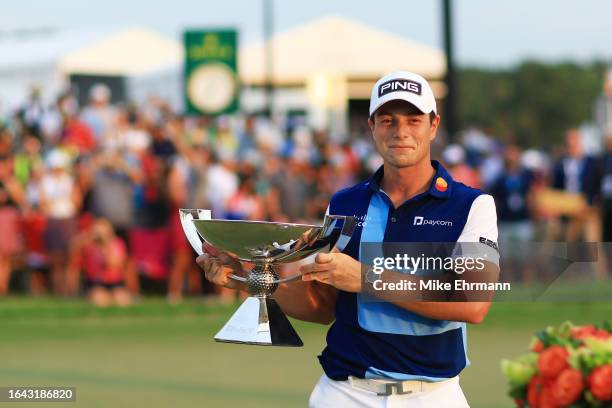 Viktor Hovland of Norway celebrates with the FedEx Cup after winning during the final round of the TOUR Championship at East Lake Golf Club on August...