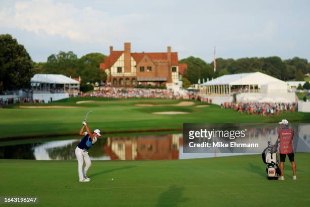 Viktor Hovland of Norway plays a shot on the 18th hole during the final round of the TOUR Championship at East Lake Golf Club on August 27, 2023 in...