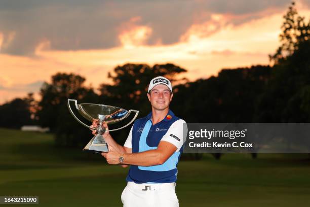 Viktor Hovland of Norway celebrates with the FedEx Cup after winning during the final round of the TOUR Championship at East Lake Golf Club on August...