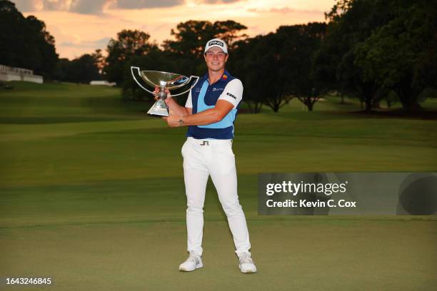 Viktor Hovland of Norway celebrates with the FedEx Cup after winning during the final round of the TOUR Championship at East Lake Golf Club on August...