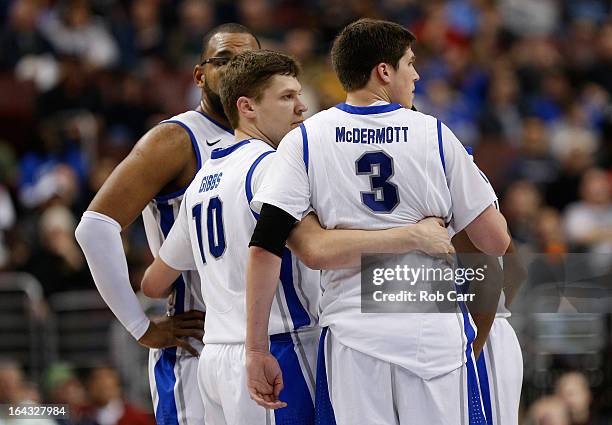 Grant Gibbs hugs Doug McDermott of the Creighton Bluejays late in the second half while taking on the Cincinnati Bearcats during the second round of...