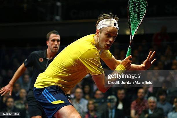 James Willstrop of England in action against Peter Barker of England in the final of the Canary Wharf Squash Classic on March 22, 2013 in London,...