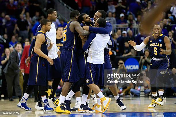The La Salle Explorers celebrate their 63-61 win over the Kansas State Wildcats during the second round of the 2013 NCAA Men's Basketball Tournament...