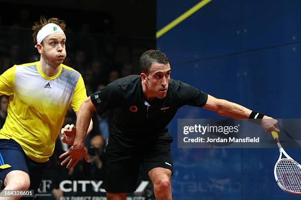 Peter Barker of England in action against James Willstrop of England in the final of the Canary Wharf Squash Classic on March 22, 2013 in London,...