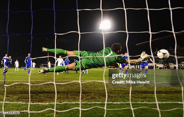 Goalkeeper Aldo Simoncini of San Marino fails to stop a free kick from Wayne Rooney of England during the FIFA 2014 World Cup Qualifier Group H match...