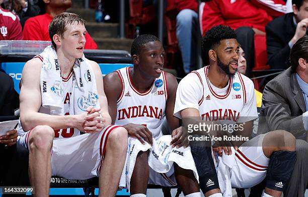 Cody Zeller, Victor Oladipo and Christian Watford of the Indiana Hoosiers look on from the bench late in the game against the James Madison Dukes...