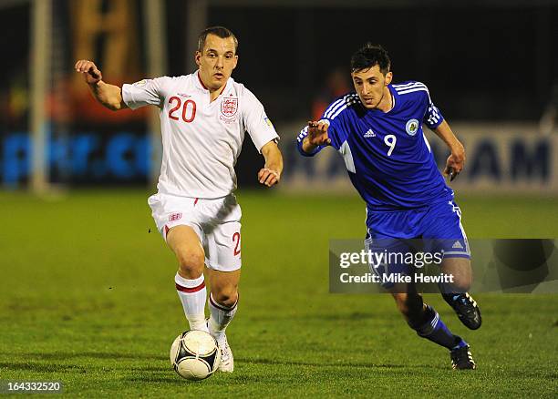 Leon Osman of England is closed down by Michele Cervellini of San Marino during the FIFA 2014 World Cup Qualifier Group H match between San Marino...