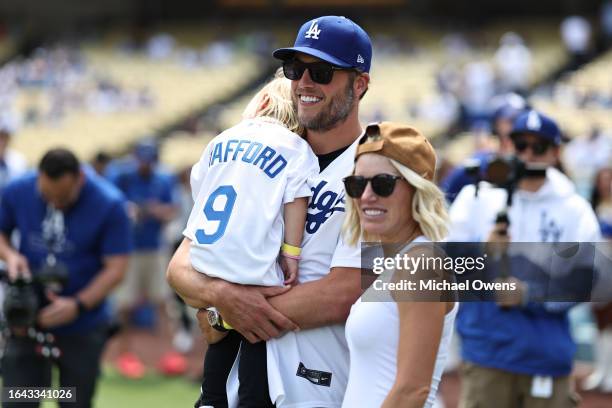 Matthew Stafford of the Los Angeles Rams and his wife Kelly Stafford look on prior to the game between the Atlanta Braves and the Los Angeles Dodgers...