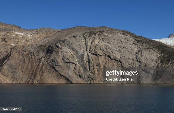cracked mountain in prince christian sound, greenland - prince christian sound greenland stock pictures, royalty-free photos & images