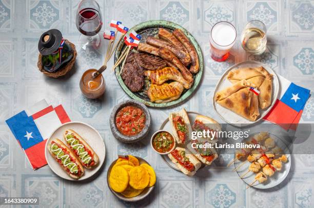 chilean independence day table with traditional festive food for fiestas patrias. dish and drink on 18 september party. - asado stock-fotos und bilder