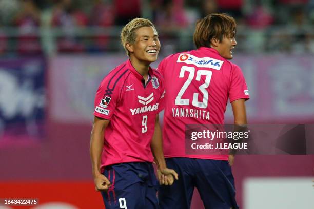 Ryo Nagai of Cerezo Osaka celebrates with his teammate Tatsuya Yamashita after scoring his team's second goal during the J.League J1 match between...