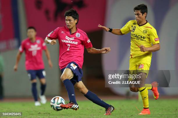 Takahiro Ogihara of Cerezo Osaka controls the ball against Dudu of Kashiwa Reysol during the J.League J1 match between Cerezo Osaka and Kashiwa...