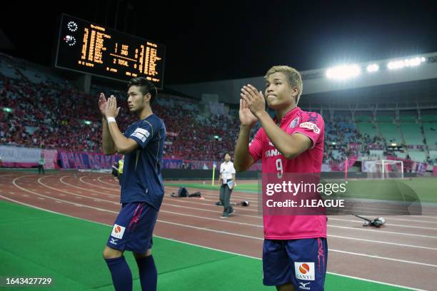 Kenyu Sugimoto and Ryo Nagai of Cerezo Osaka applaud fans after the team's 2-0 victory in the J.League J1 match between Cerezo Osaka and Kashiwa...