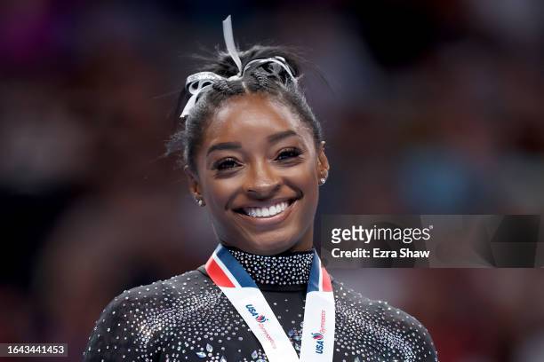 Simone Biles celebrates after placing first in the floor exercise competition on day four of the 2023 U.S. Gymnastics Championships at SAP Center on...