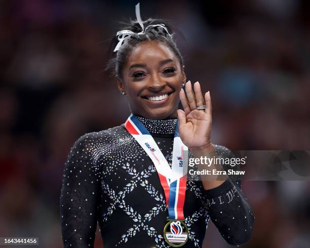 Simone Biles celebrates after placing first in the floor exercise competition on day four of the 2023 U.S. Gymnastics Championships at SAP Center on...