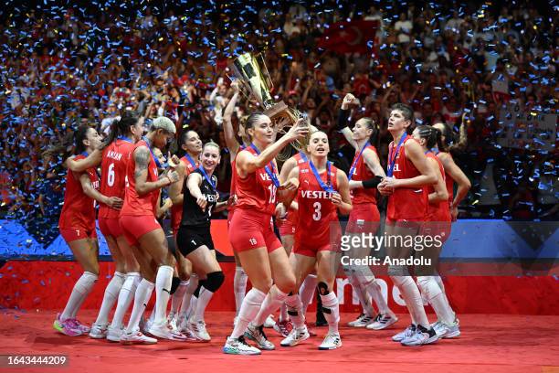 Turkish players holding trophy celebrate their victory after defeating Serbia in a five-set match at the end of the 2023 CEV EuroVolley Women final...