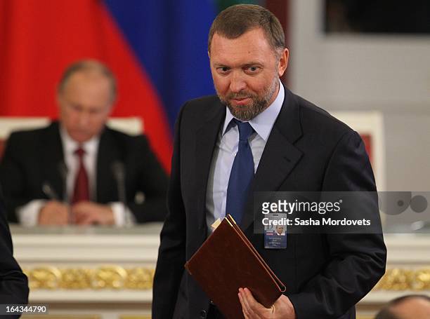 Russian billionaire and businessman Oleg Deripaska attends a meeting with Chinese President Xi Jinping and Russian President Vladimir Putin in the...