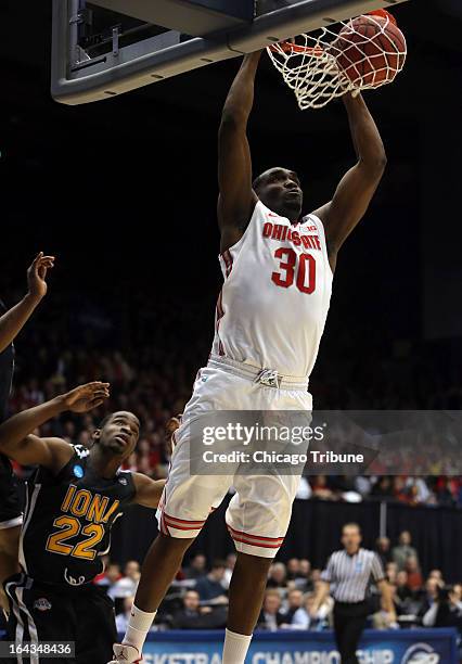 Ohio State's Evan Ravenel dunks over Iona's Sean Armand in the first half in the second round of the NCAA Tournament at the University of Dayton...