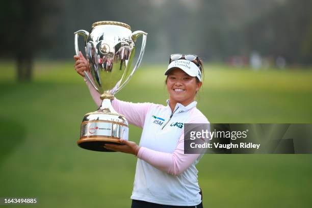Megan Khang of the United States poses with the trophy after winning the CPKC Women's Open on the first playoff hole at Shaughnessy Golf and Country...