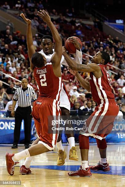 Jamaal Franklin of the San Diego State Aztecs drives against Steven Pledger and Je'lon Hornbeak of the Oklahoma Sooners during the second round of...