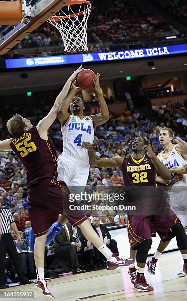 Norman Powell of the UCLA Bruins takes a shot over Elliott Eliason of the Minnesota Golden Gophers during the second round of the 2013 NCAA Men's...
