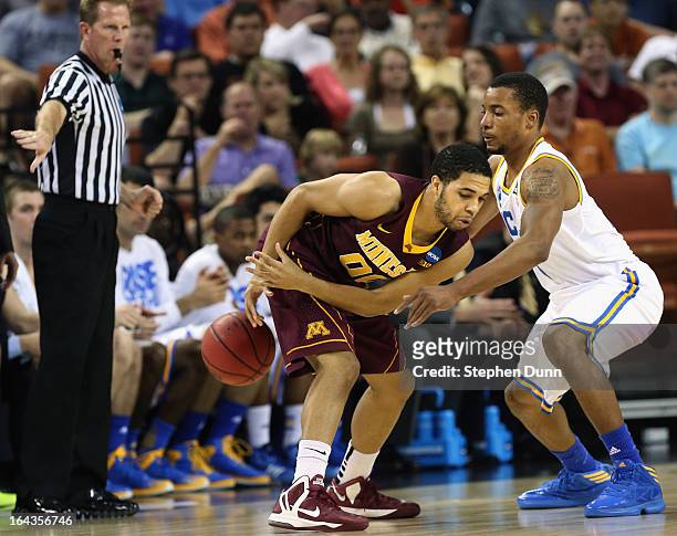 Julian Welch of the Minnesota Golden Gophers plays against Norman Powell of the UCLA Bruins during the second round of the 2013 NCAA Men's Basketball...