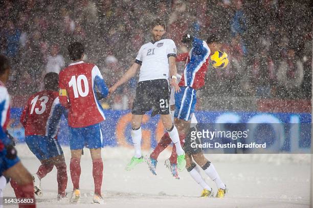 Defender Clarence Goodson of the United States attempts a head-in on a corner kick among a crowd of Costa Rican defenders during a FIFA 2014 World...