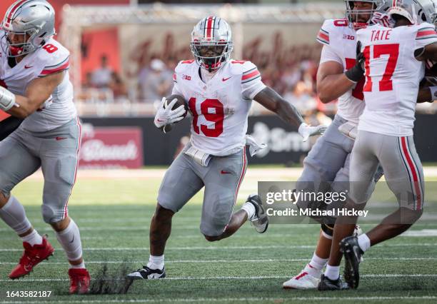 Chip Trayanum of the Ohio State Buckeyes runs the ball during the game against the Indiana Hoosiers at Memorial Stadium on September 2, 2023 in...