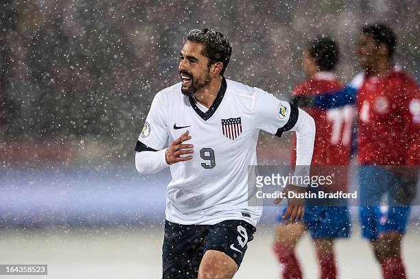 Forward Herculez Gomez of the United States smiles after his teammate scored the loan goal in the game during a FIFA 2014 World Cup Qualifier match...