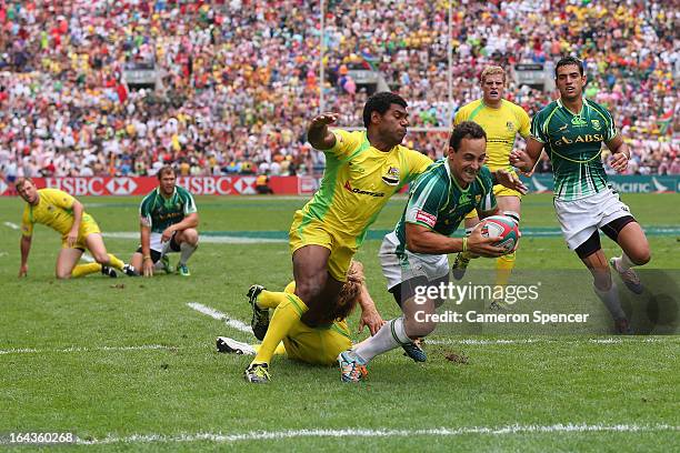 Paul Delport of South Africa scores a try during the match between Australia and South Africa during day two of the 2013 Hong Kong Sevens at Hong...