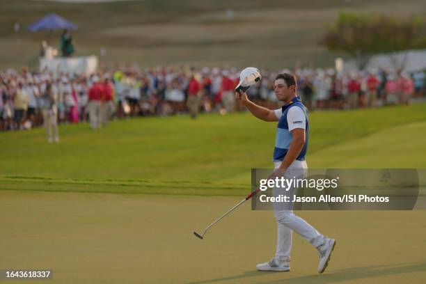 Viktor Hovland of Norway waves to the crowd after winning the TOUR Championship on the green of hole during the final round at East Lake Golf Club on...