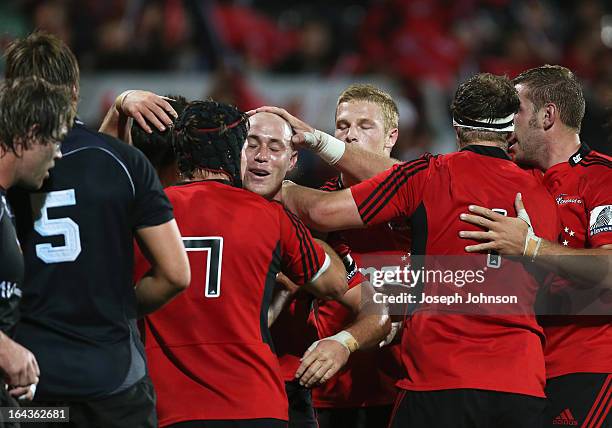 Willie Heinz of the Crusaders is congratulated by team mates after his try during the round six Super Rugby match between the Crusaders and the Kings...