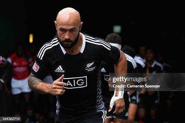 New Zealand captain D J Forbes and his team run onto the field for the match between New Zealand and Portugal during day two of the 2013 Hong Kong...