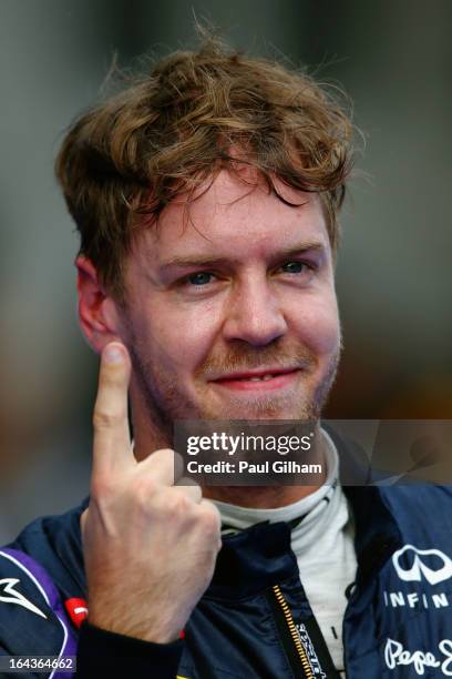 Sebastian Vettel of Germany and Infiniti Red Bull Racing celebrates finishing first during qualifying for the Malaysian Formula One Grand Prix at the...