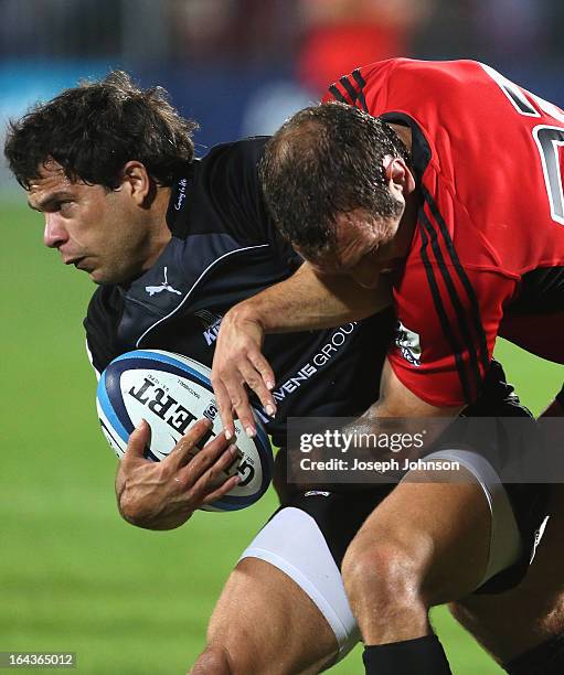 Nicholas Vergallo of the Kings in the tackle of Adam Whitelock of the Crusaders during the round six Super Rugby match between the Crusaders and the...