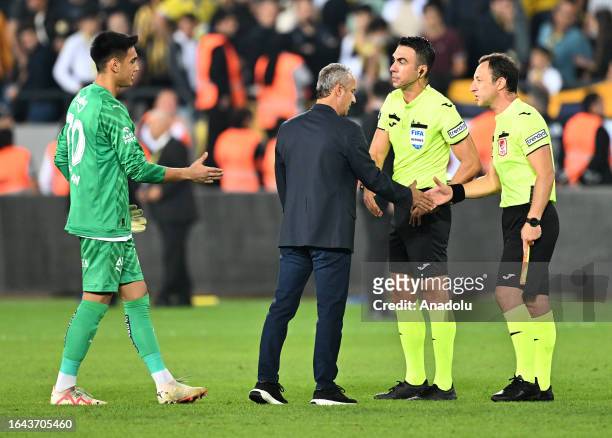 Head coach Ismail Kartal and goalkeeper Irfan Can Egribayat of Fenerbahce shake hands with referees after their team's victory following Turkish...